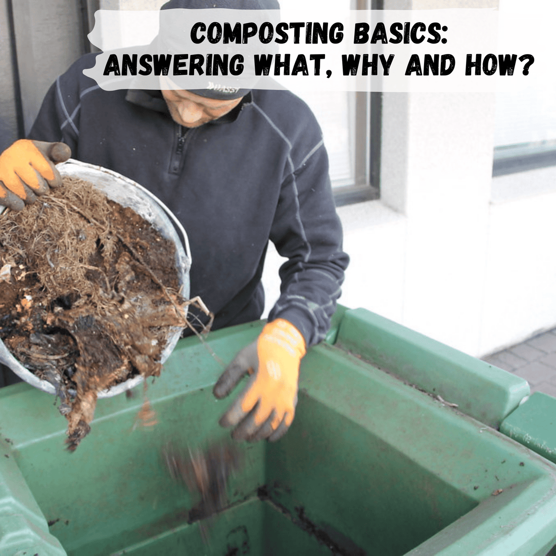man dumping compost scraps into large green compost bin